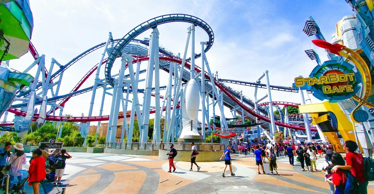 people of amusement park under clear blue sky during daytime