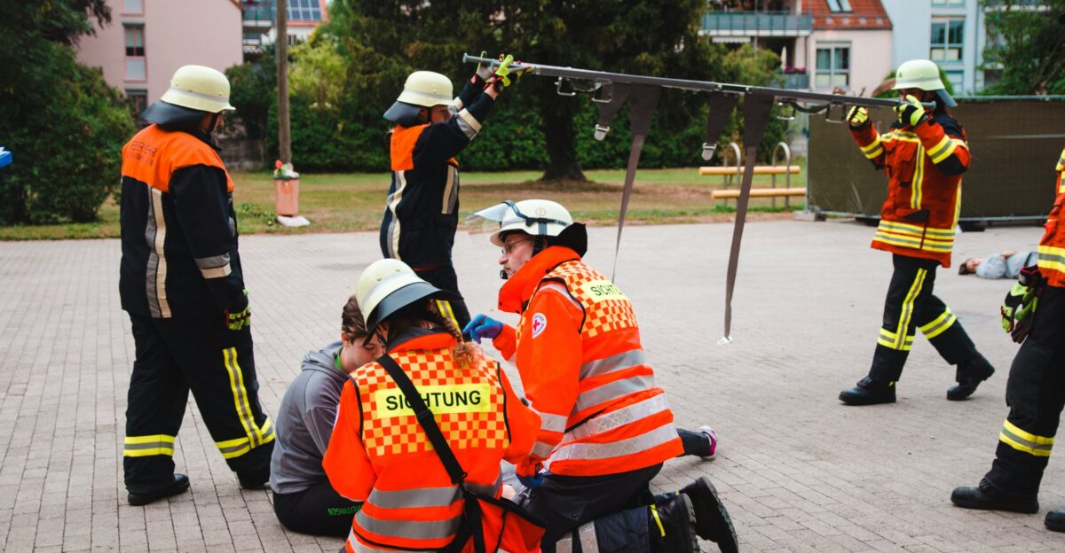 firemen performing drill outdoors
