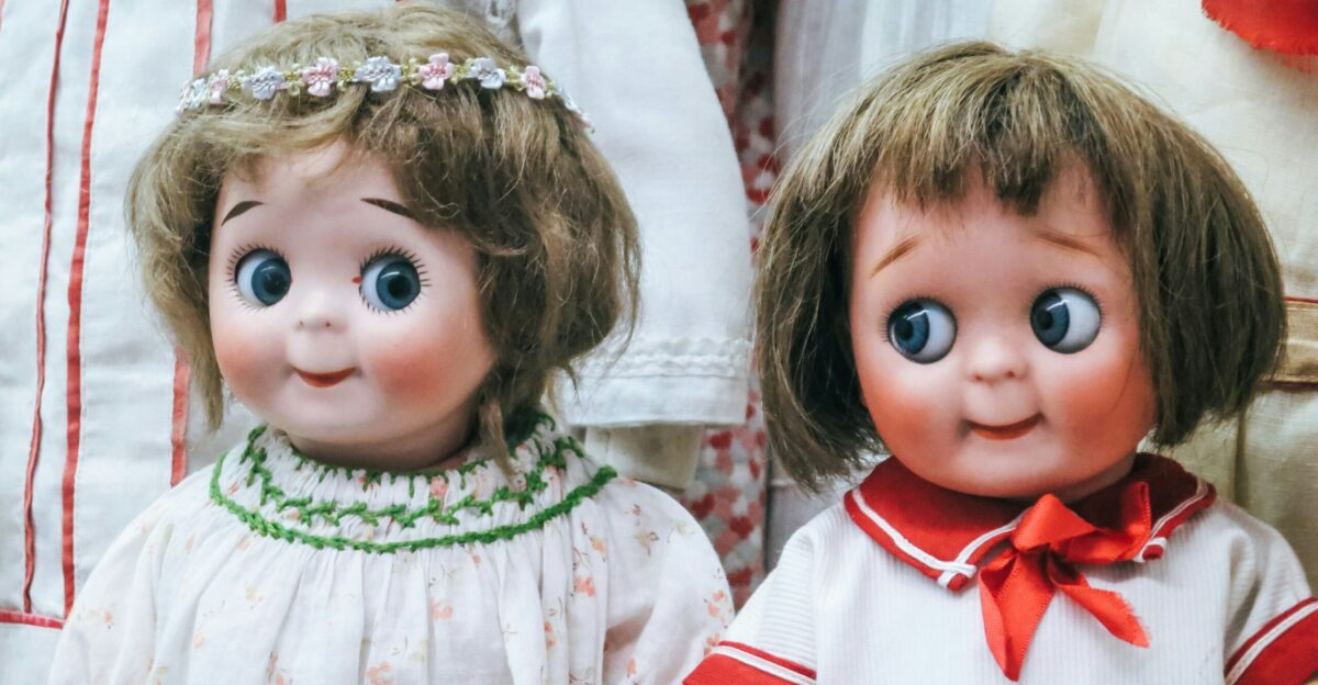 two female doll wearing white tops
