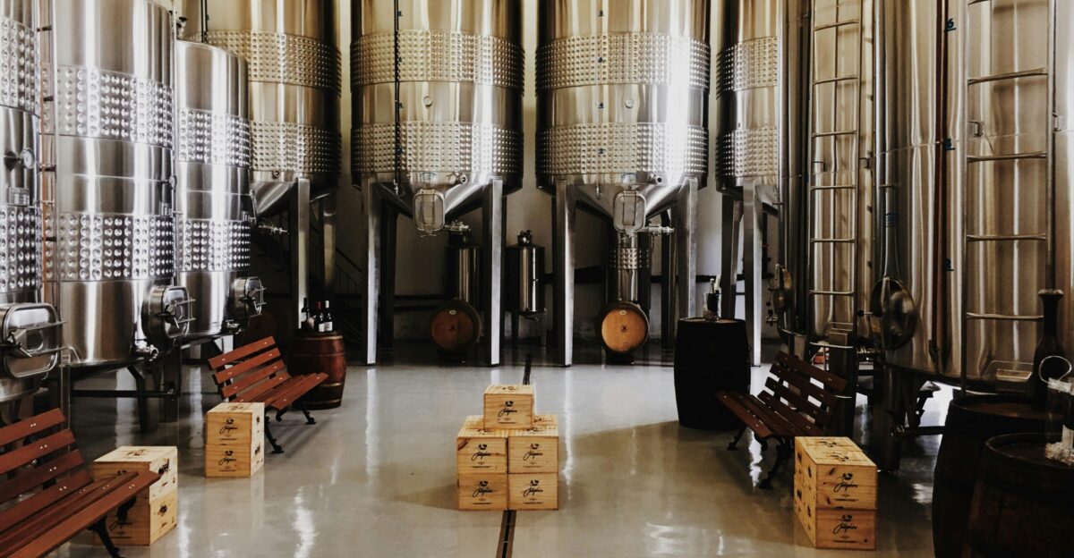 brown cardboard box near gray tanks