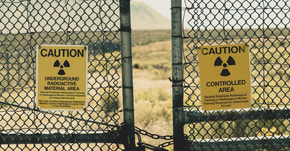 a couple of signs that are on a fence