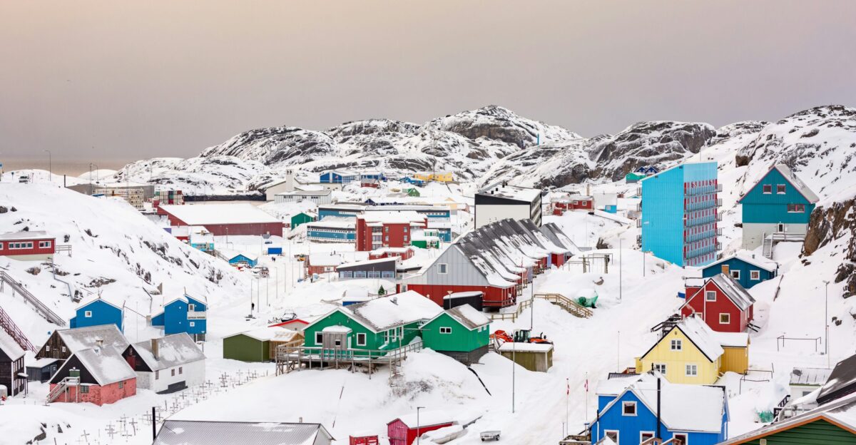 town on hill covered with snow