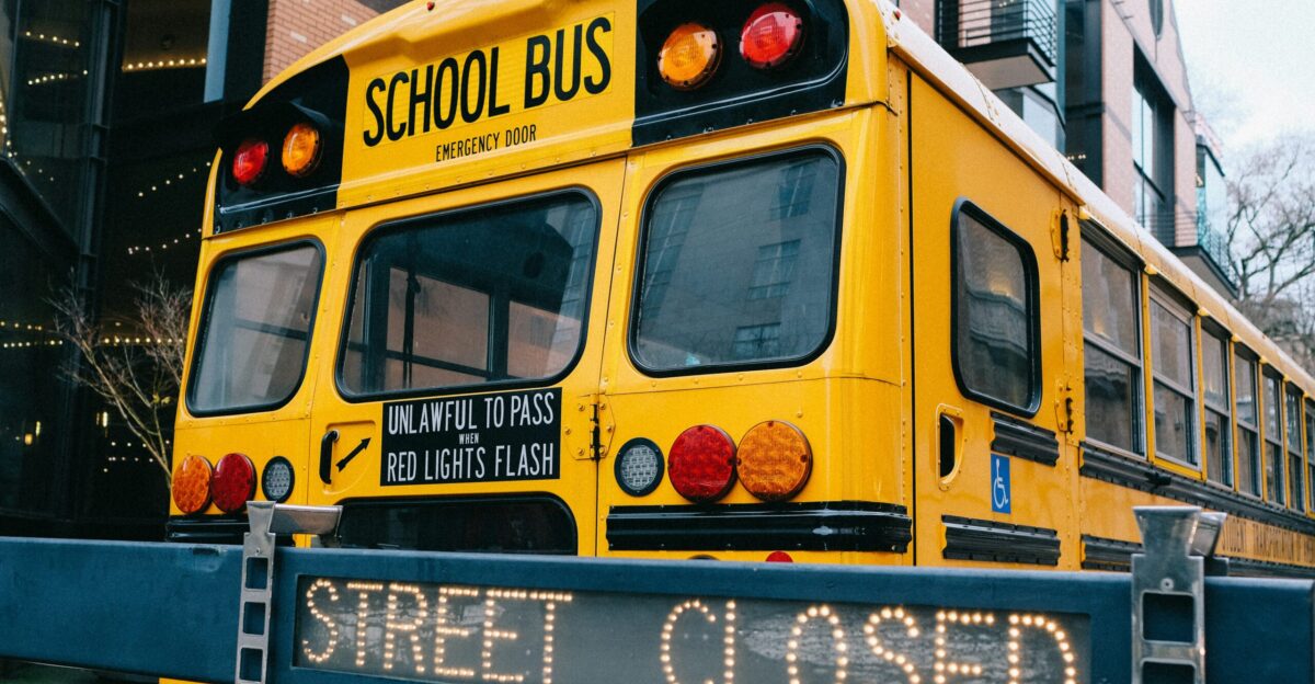 yellow school bus on road during daytime