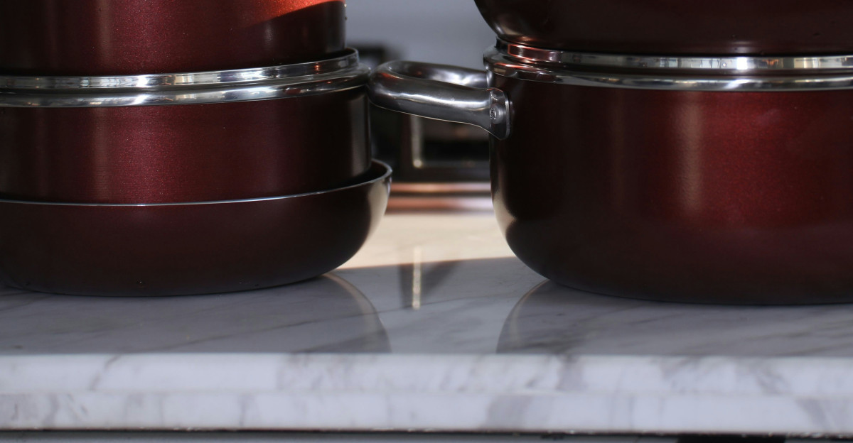 red and silver steel cooking pots