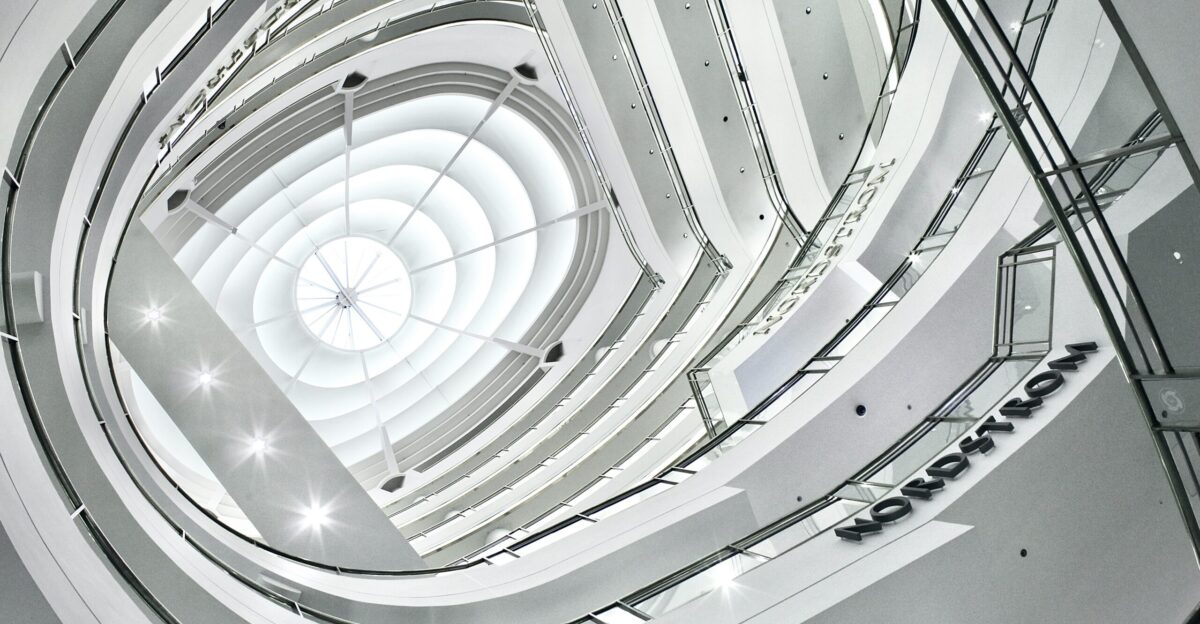 white spiral staircase in grayscale photography