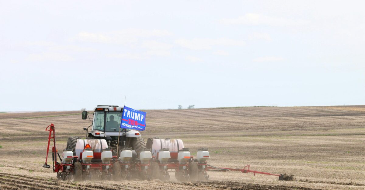 white and black truck on brown field during daytime