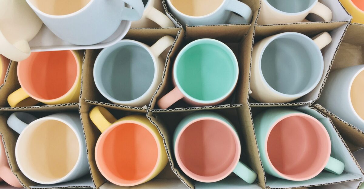 white blue orange and green ceramic mugs