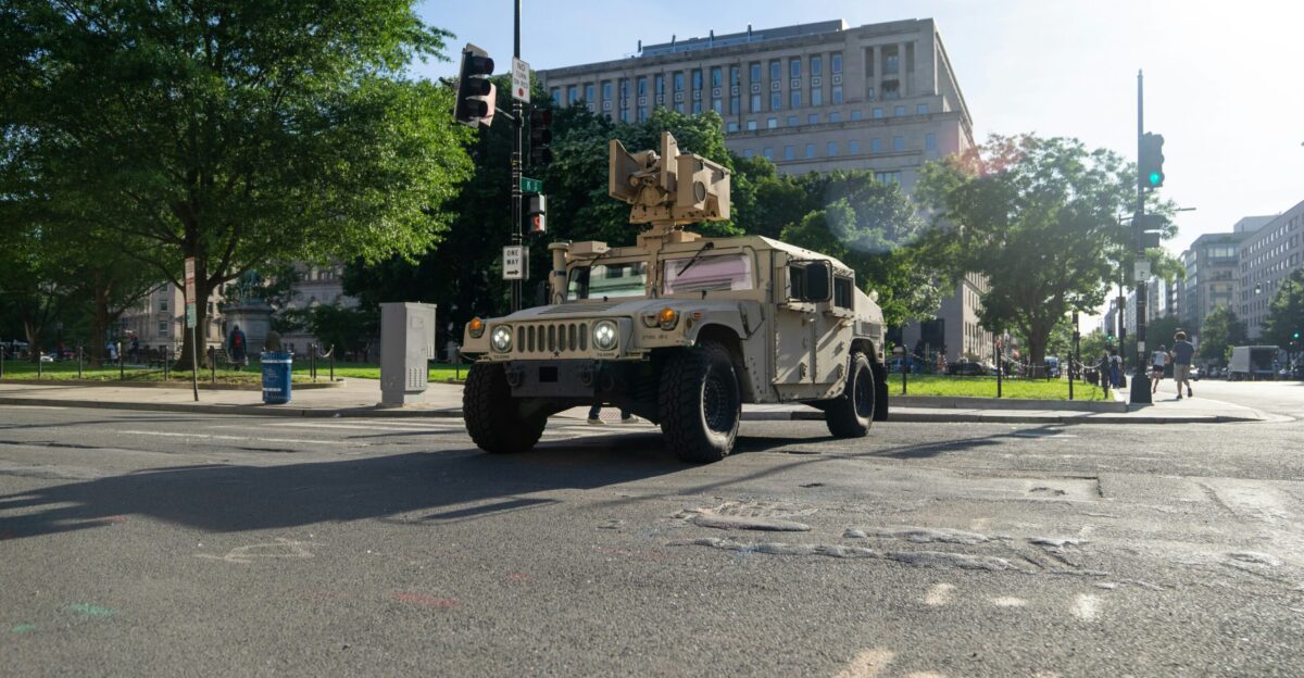white and black jeep wrangler parked on gray asphalt road during daytime