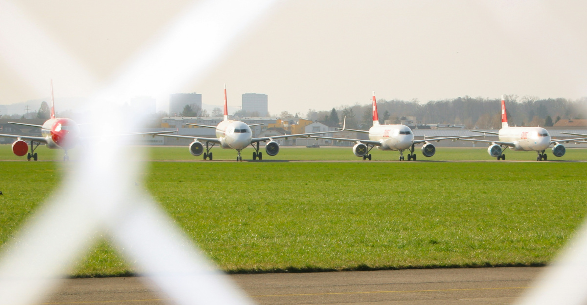 white and black cars on parking lot during daytime