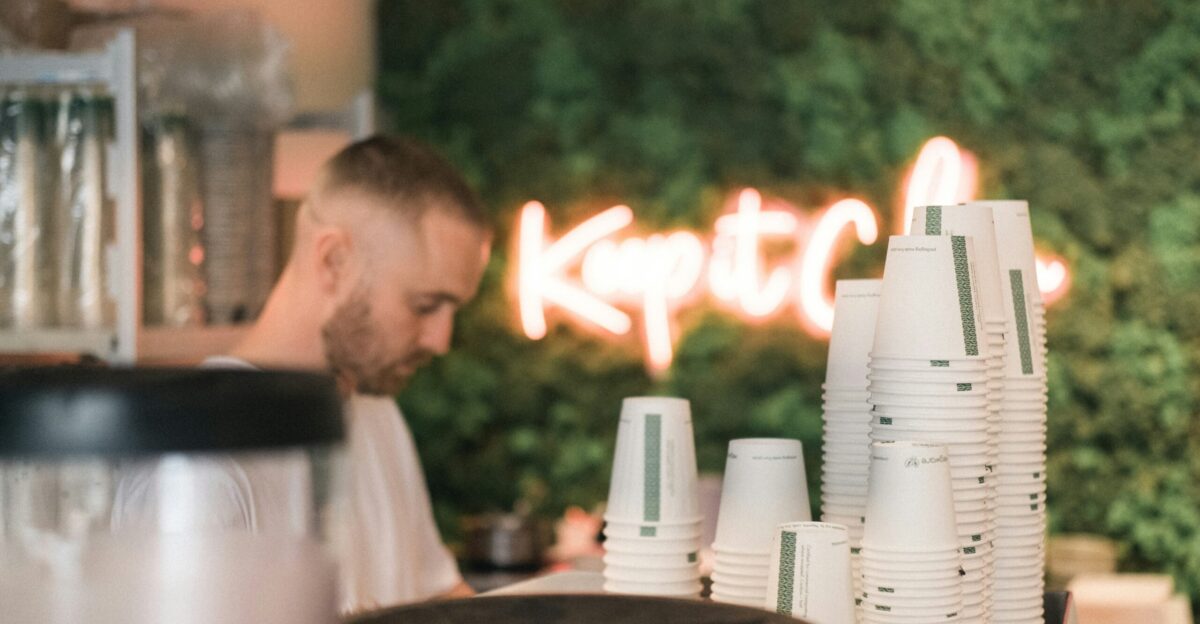 man in white crew neck t-shirt sitting on chair