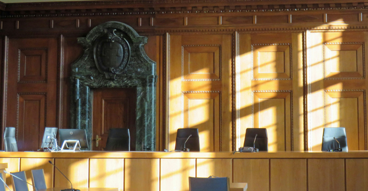 black cross on brown wooden table