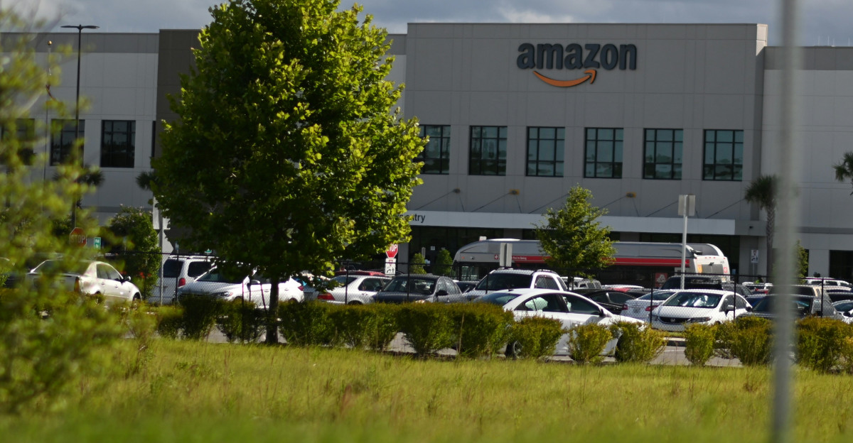 cars parked on parking lot near building during daytime