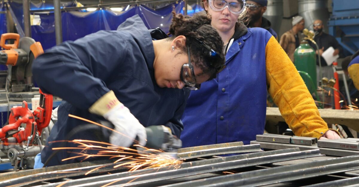 man in blue long sleeve shirt and blue vest