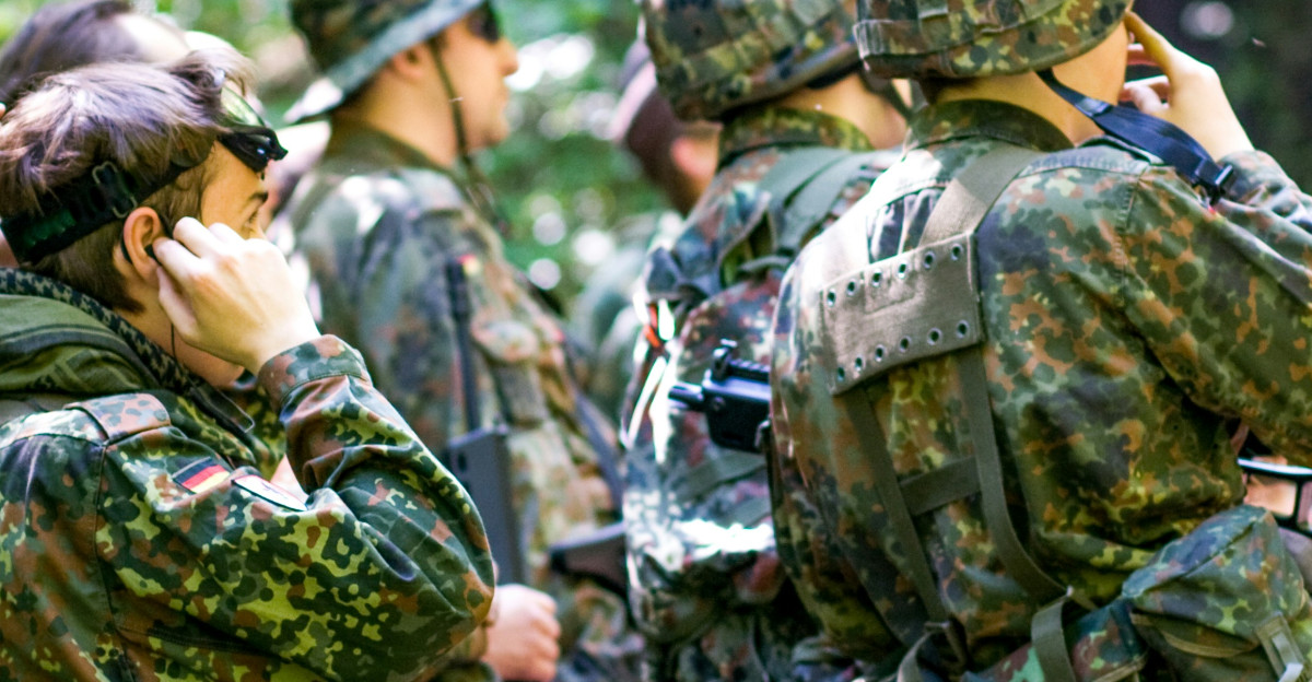 men in green and brown camouflage uniform