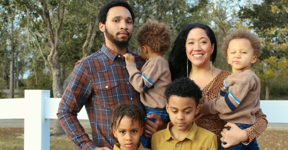 group of people standing on green grass field during daytime