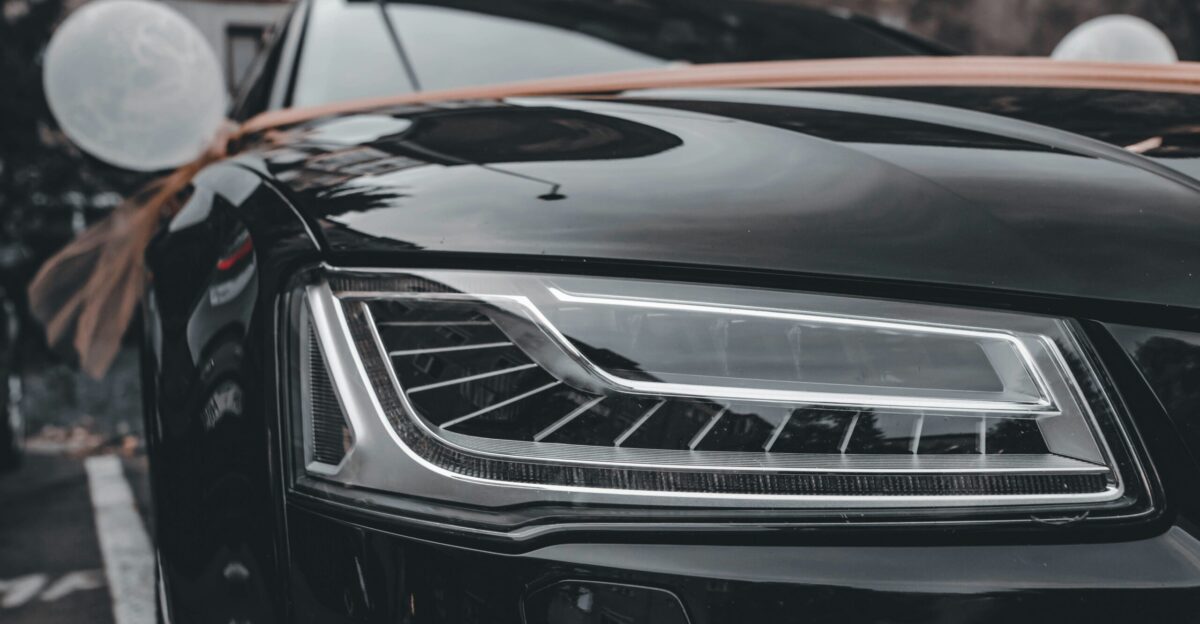 a black car parked on the side of the road