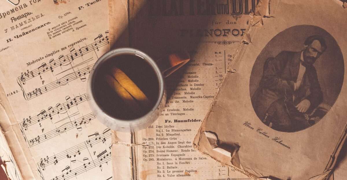 white ceramic mug on book page