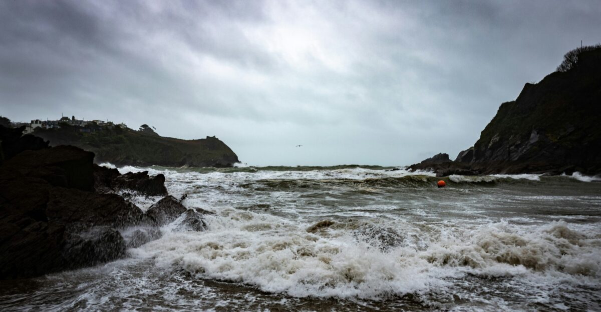 ocean waves crashing on shore during daytime