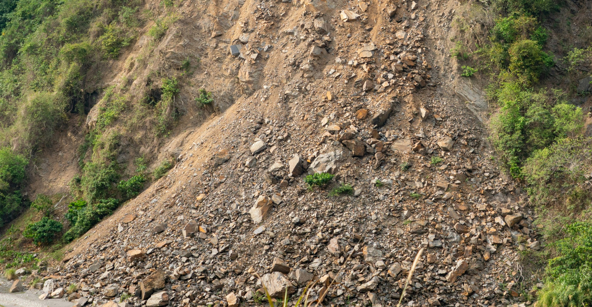 brown and white concrete building on hill