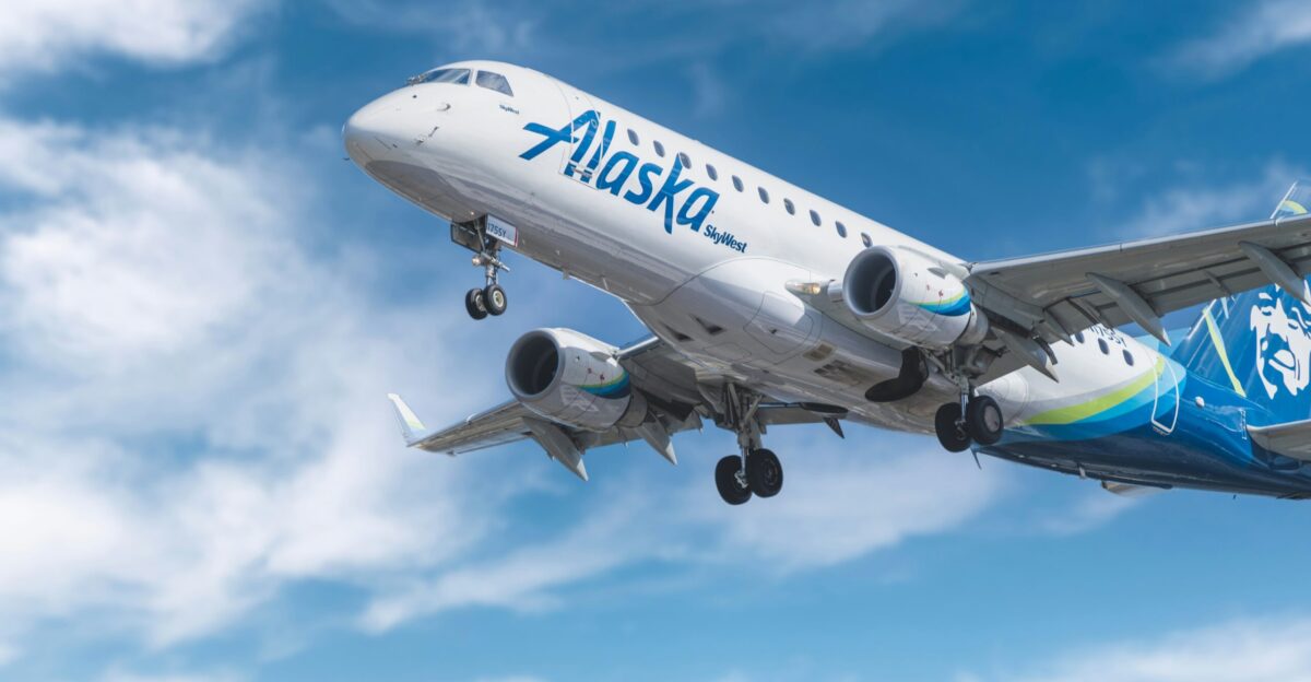 white and blue passenger plane under blue sky during daytime