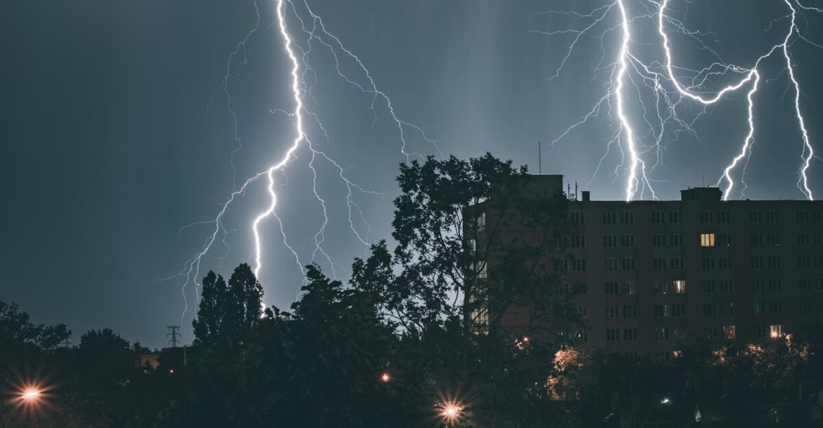 a large building with a lot of lightning in the sky