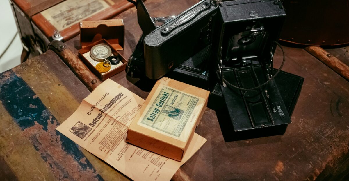black and silver camera on brown wooden table