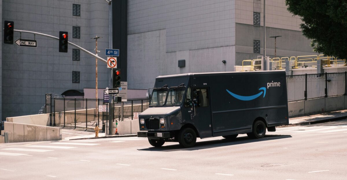 blue and white van parked near white building during daytime