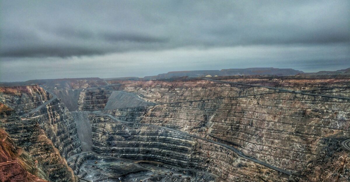 a view of a large open pit in the middle of nowhere