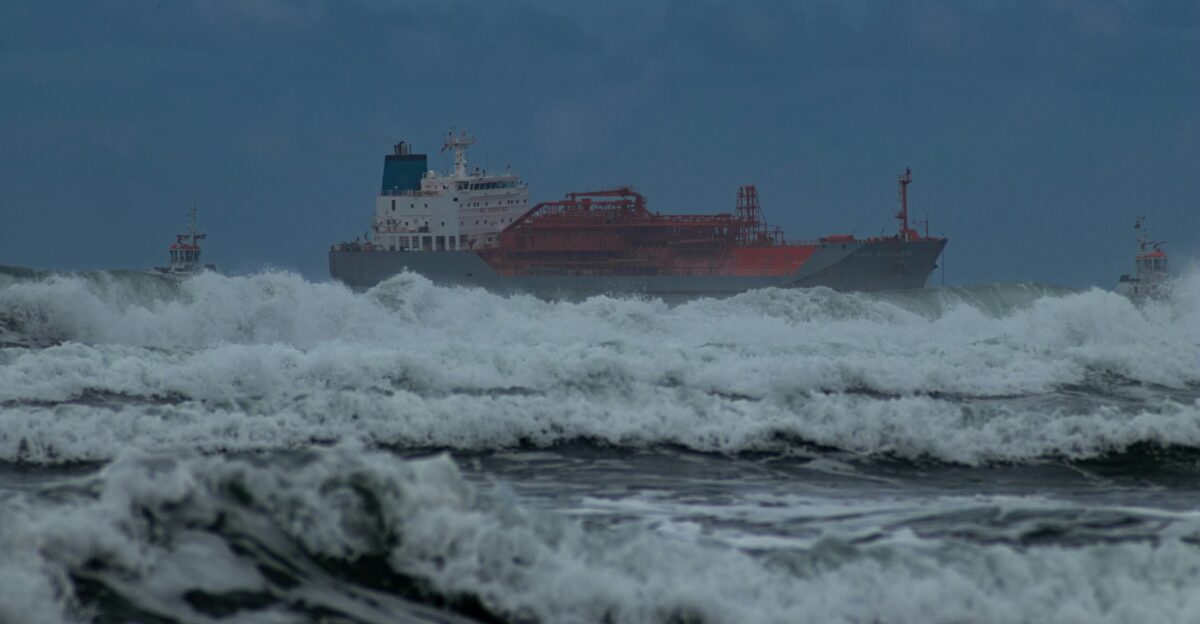 red and white ship on sea during daytime