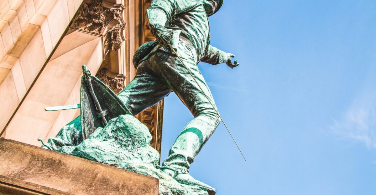 a statue of a man holding a baseball bat