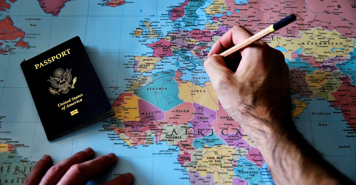 a person is writing on a map with a pencil