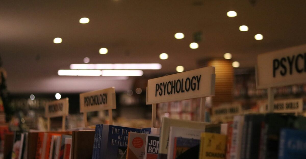 a row of books on a shelf in a library