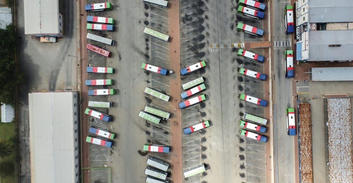 an aerial view of a parking lot filled with cars