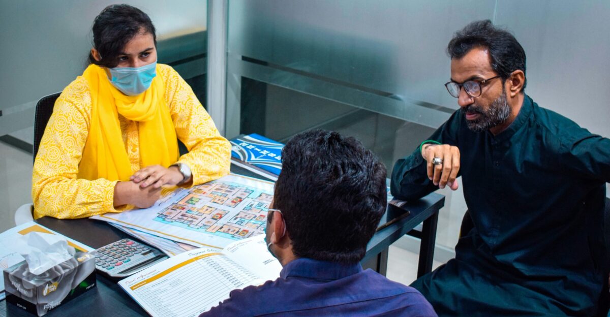 a group of people sitting around a table