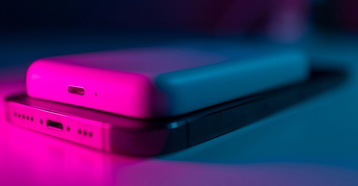 a couple of cell phones sitting on top of a table