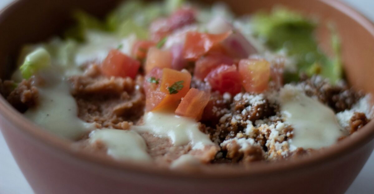 a close up of a bowl of food on a table