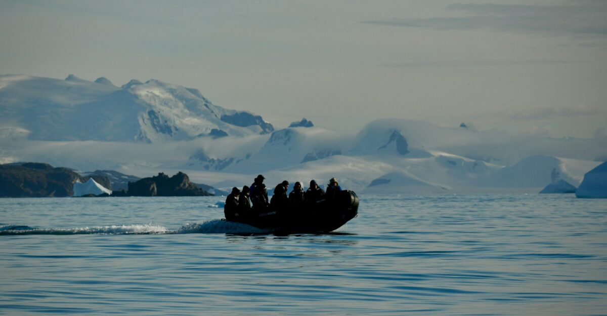 a group of people on a boat in the water
