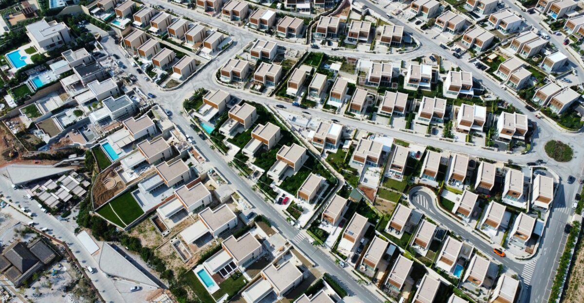 an aerial view of a city with lots of houses