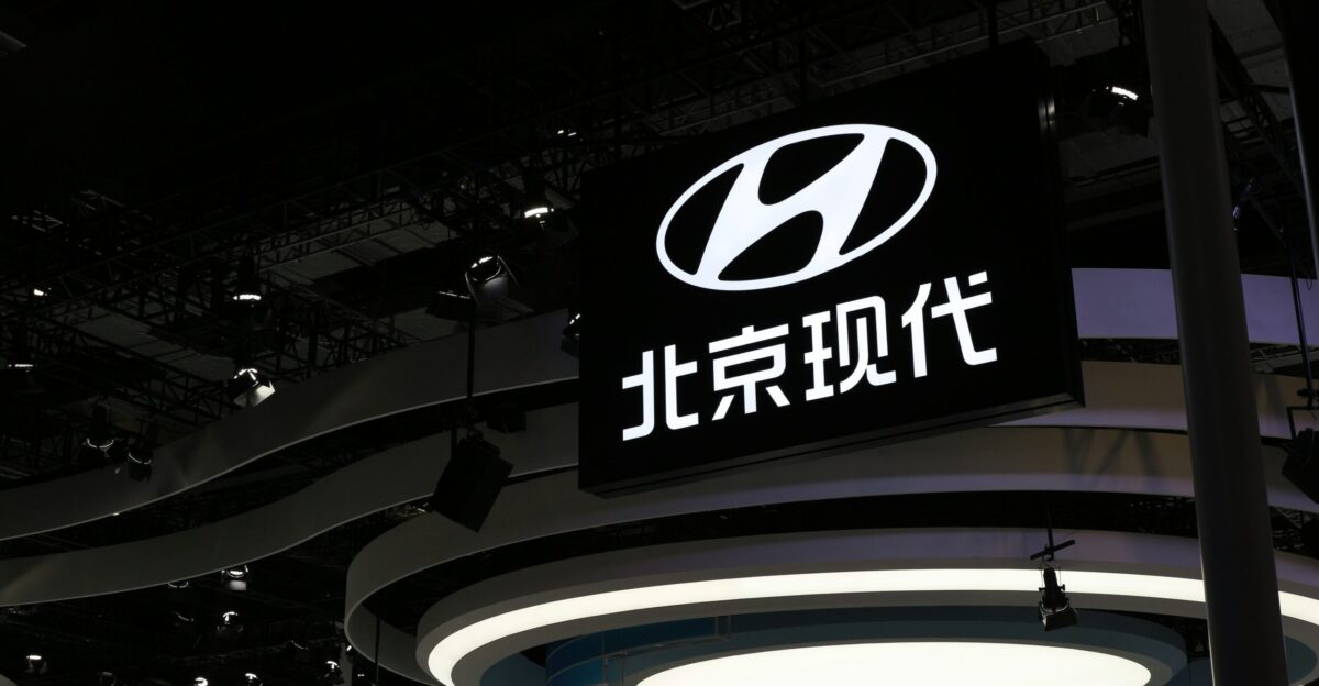 a sign hanging from the ceiling of a building