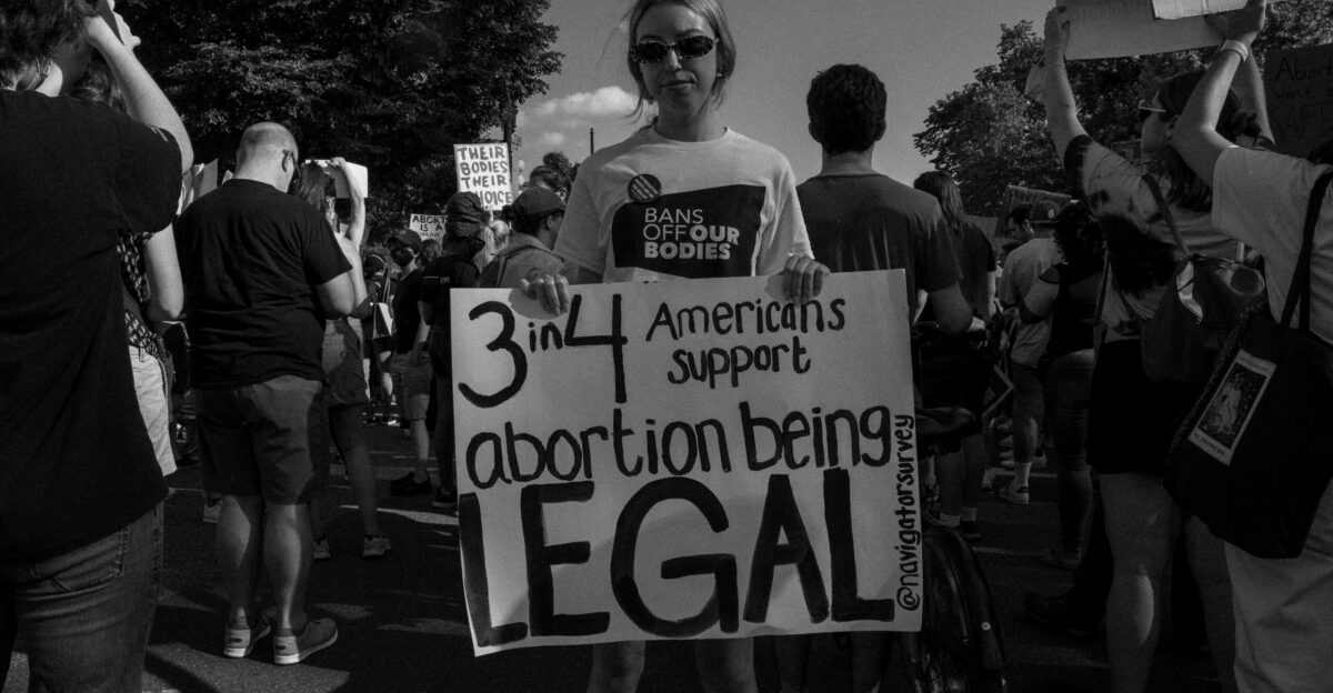 a person holding a sign