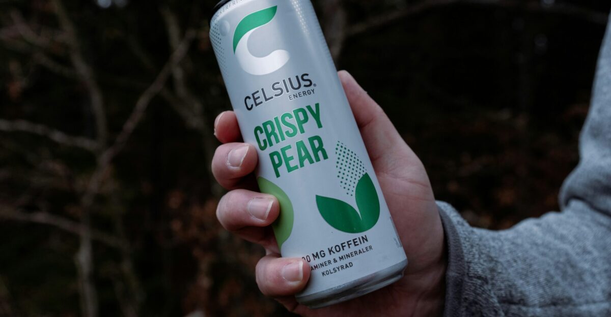 a person holding a can