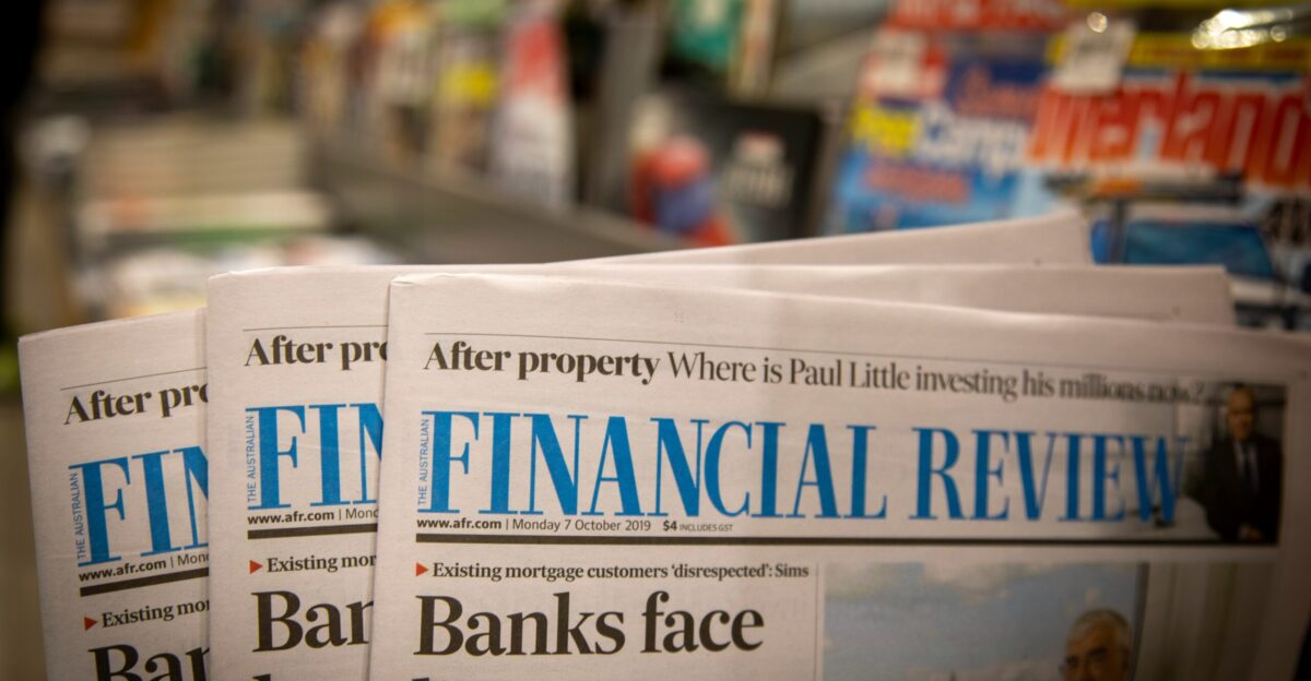 newspapers are stacked on top of each other