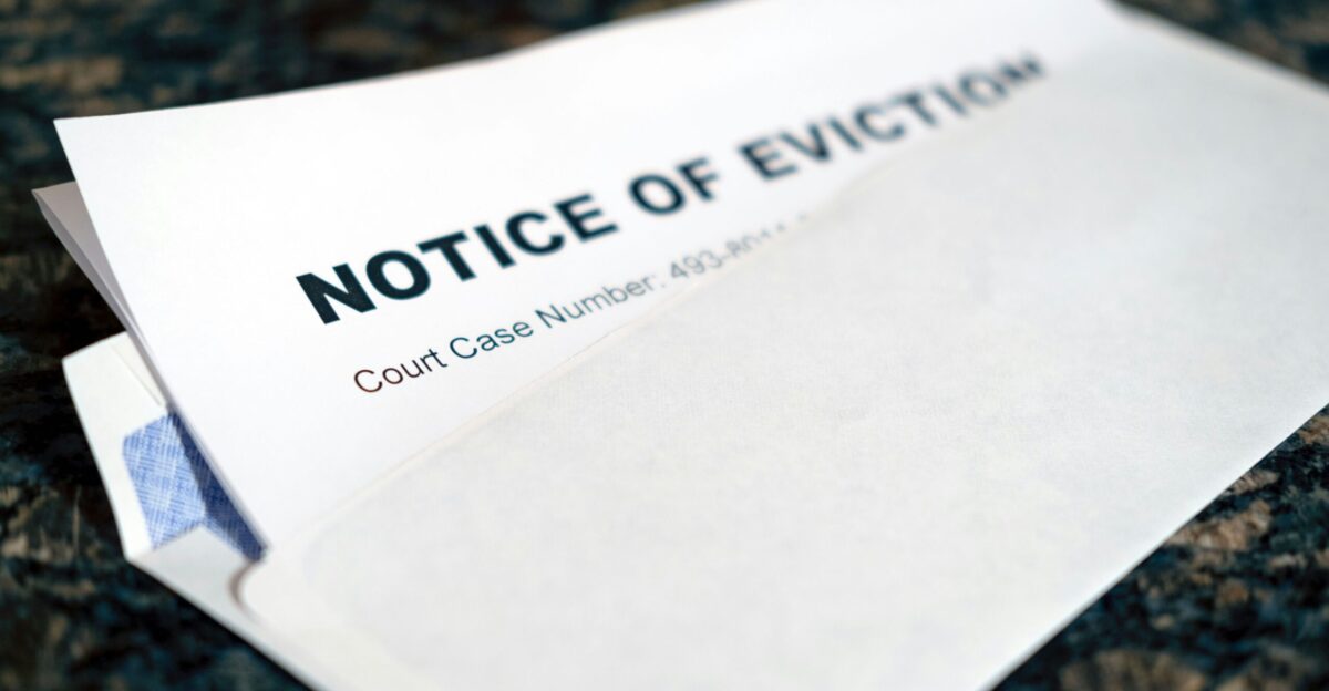 a close up of a piece of paper with a notice of eviction on it