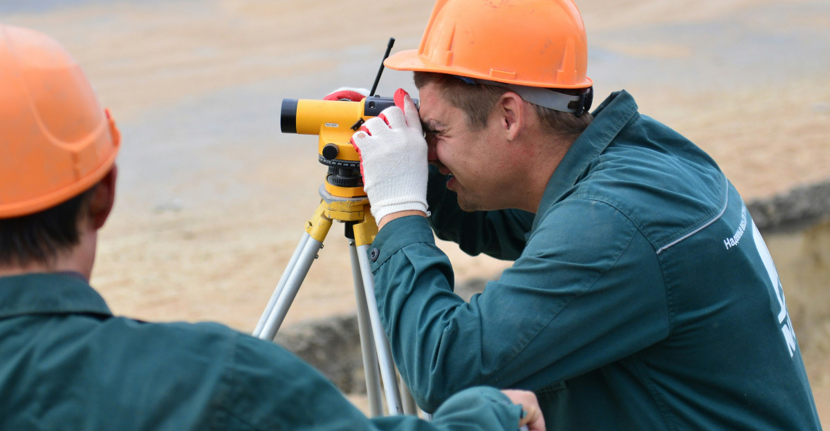 a couple of men standing next to each other