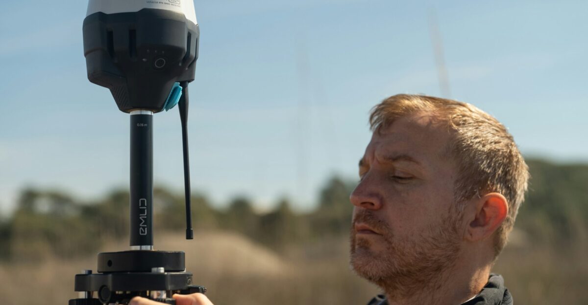 a man holding a camera in front of his face
