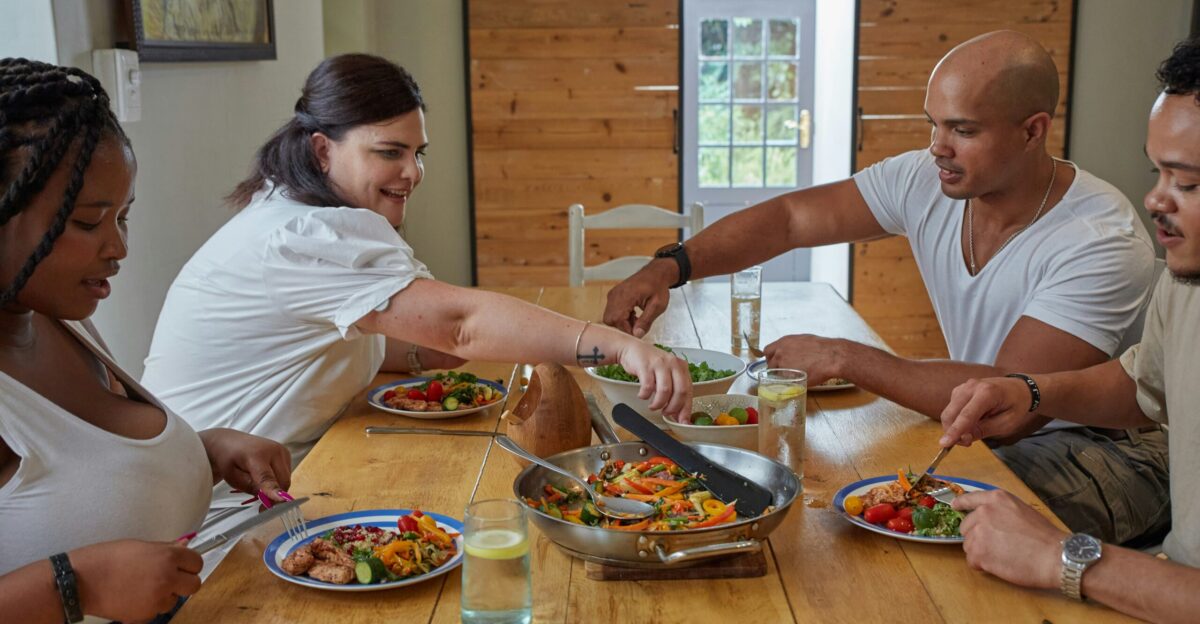 a group of people sitting around a table eating food