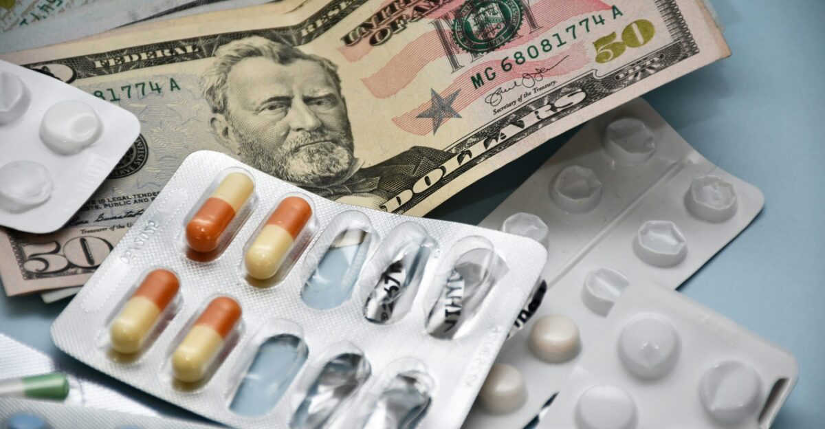 a pile of pills and money sitting on top of a table