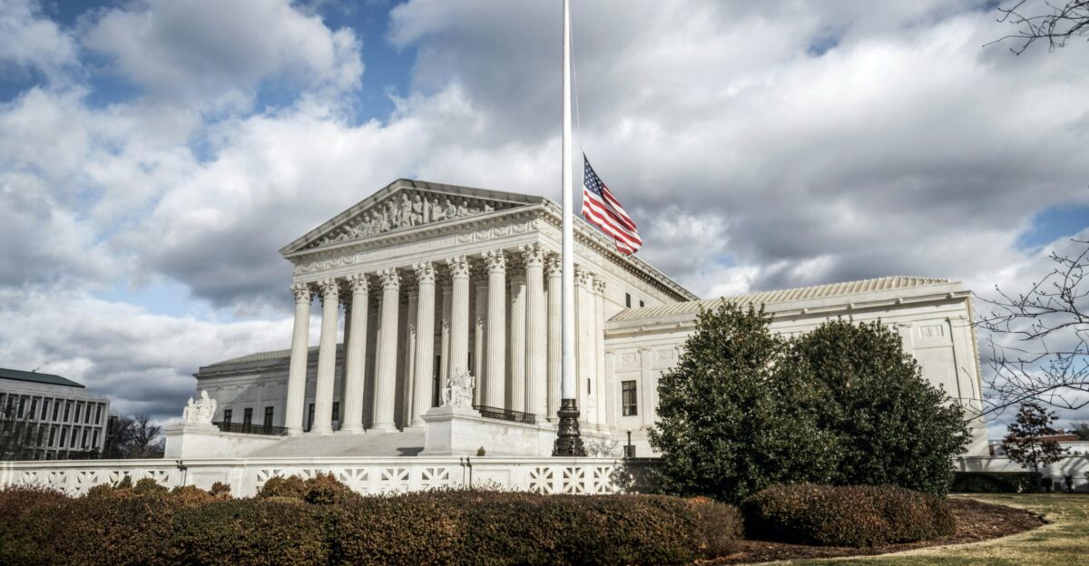 a large building with a flag on top of it