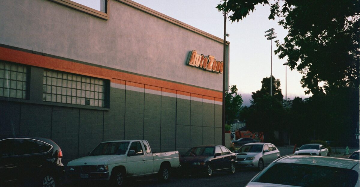 a parking lot filled with lots of parked cars