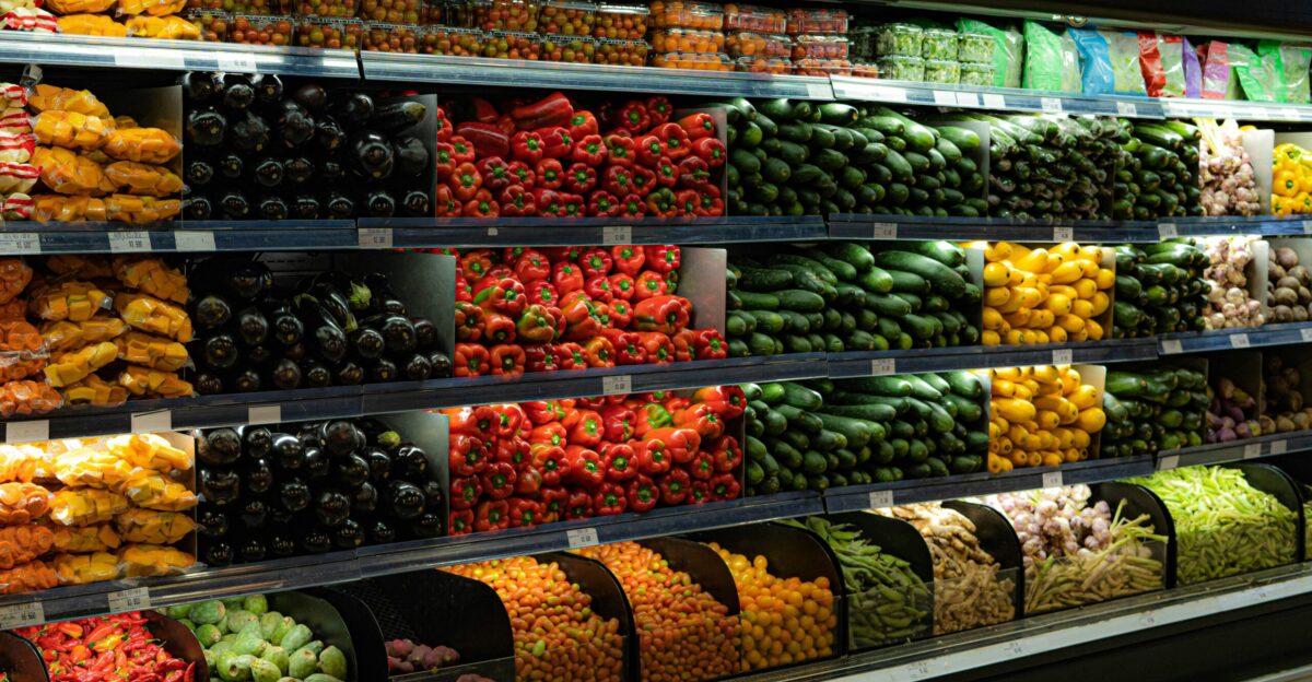 a display in a grocery store filled with lots of fruits and vegetables
